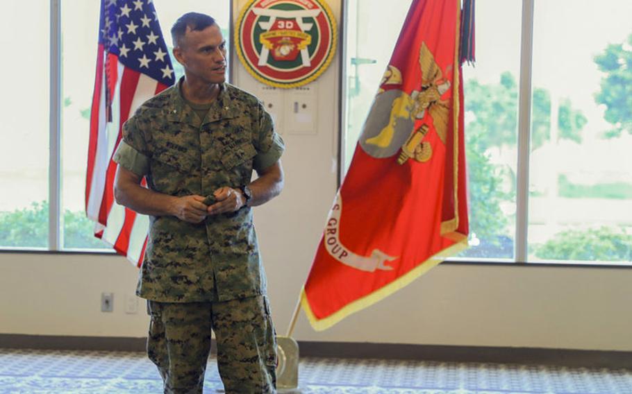 U.S. Marine Corps Brig. Gen. Brian Wolford, incoming commanding general of 3rd Marine Logistics Group (MLG), speaks during his assumption of command with Col. Maura Hennigan, off going commander of 3rd MLG, on Camp Kinser, Okinawa, Japan, Aug. 19, 2020. (U.S. Marine Corps photo by Pfc. Courtney A. Robertson)