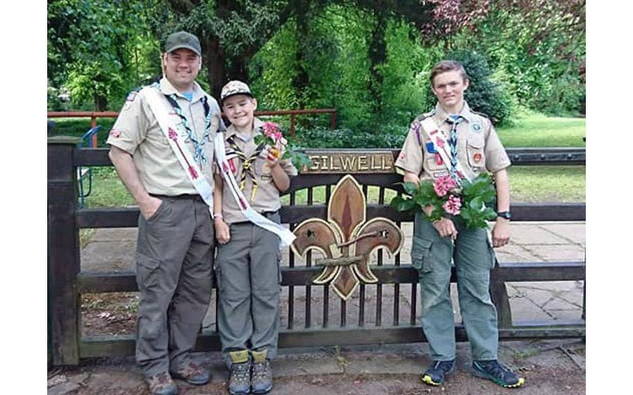 Lt. Col. Joel Gleason, commander of U.S. Army Garrison Okinawa and Scoutmaster of Boy Scout Troop 101 in Okinawa, poses for a photo with his sons Kipp and Colton at Gilwell Park, London, during a scouting event in May 2019. Gilwell is the home of the worldwide organization of the scouting movement and where its founder, Lord Robert Baden-Powell, first developed many of the scouting activities still popular today. (Photo Credit: U.S. Army)