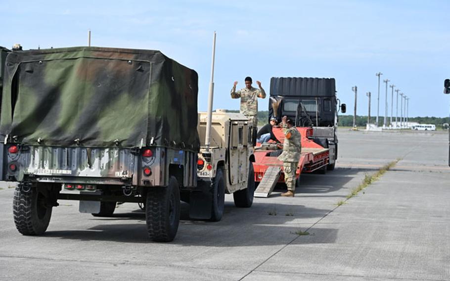 10th Support Group personnel load vehicles at Chitose Airport onto a truck to prepare for transport to a remote site in Northern Japan in support of Orient Shield 23 on Sept. 13. Orient Shield is the largest annual bilateral training exercise conducted in Japan between the Japanese Ground Self-Defense Forces and the U.S. Army.