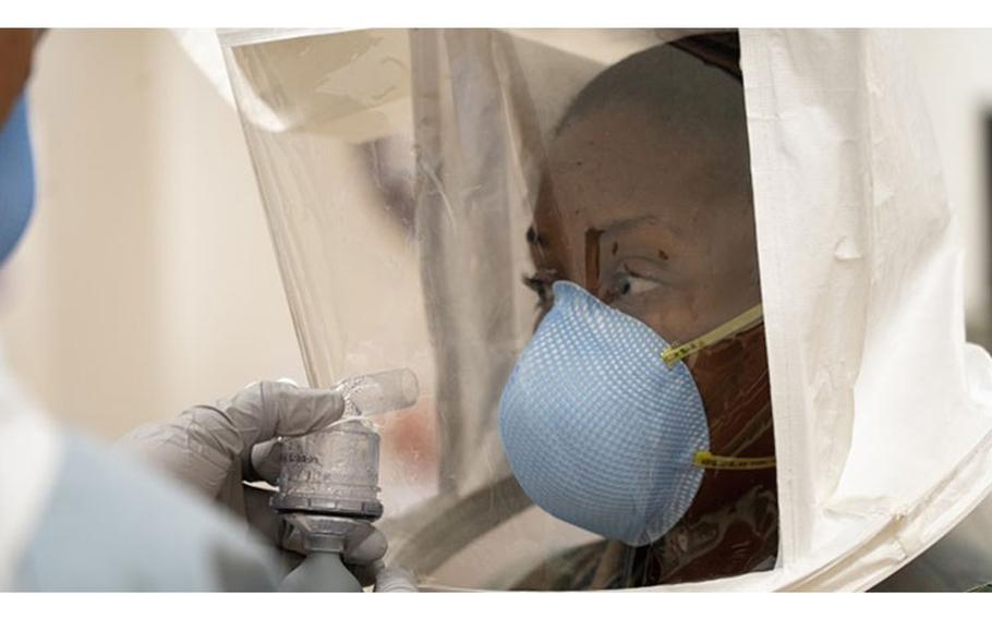 Lt. Tiffany Bradley participates in fit testing for an N95 respirator and survival mask at Naval Hospital Okinawa, Okinawa, Japan March 27, 2020. The wearing of protective gear while battling the COVID-19 pandemic can cause adverse reactions in health care workers. (U.S. Marine Corps photo by 1st Lt. Tori Sharpe)