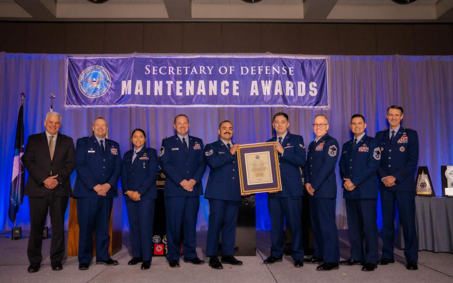 Airmen from The 18th Maintenance Group accept the Secretary of Defense’s Field-level Maintenance Award and Phoenix Award during the Secretary of Defense Maintenance Awards ceremony in San Diego, California, December 19, 2023. The 18 MXG received both awards for their efforts during Fiscal Year 2022, and for being the “Best” maintenance unit in the DoD. (Courtesy photo)