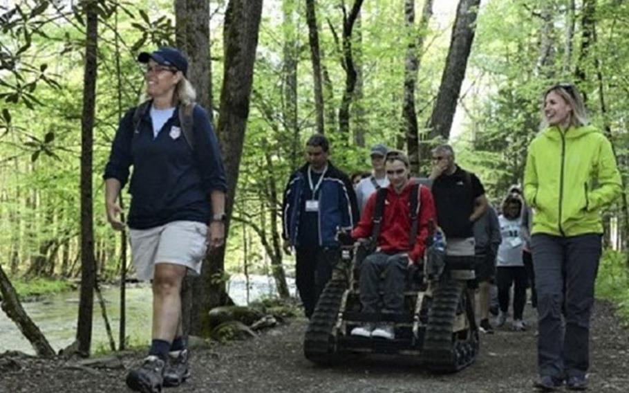 Participants of the Air Force Special Operations Command Caregiver and Resilience Education summit walk the Gatlinburg trail in Gatlinburg, Tennessee in April 2019. (Photo by Air Force Staff Sgt. Lynette Rolen.)