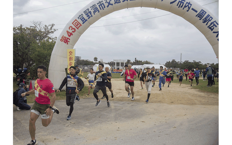 Runners participate in the 43rd Annual Ginowan Safety Relay at Marine Corps Air Station (MCAS) Futenma, Okinawa, Japan, Jan. 18, 2020. The relay race was held to raise awareness for road safety and to build the relationship between the U.S. military and local Okinawa communities. (U.S. Marine Corps photo by Lance Cpl. Zachary R. Larsen)