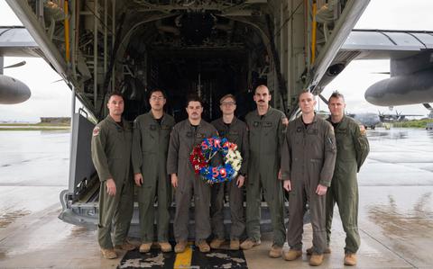 Photo Of U.S. Air Force Airmen assigned to the 1st Special Operations Squadron pose for a photo in front of an MC-130J Commando II before the annual STRAY 59 memorial flight at Kadena Air Base, Japan, Feb. 26, 2024.