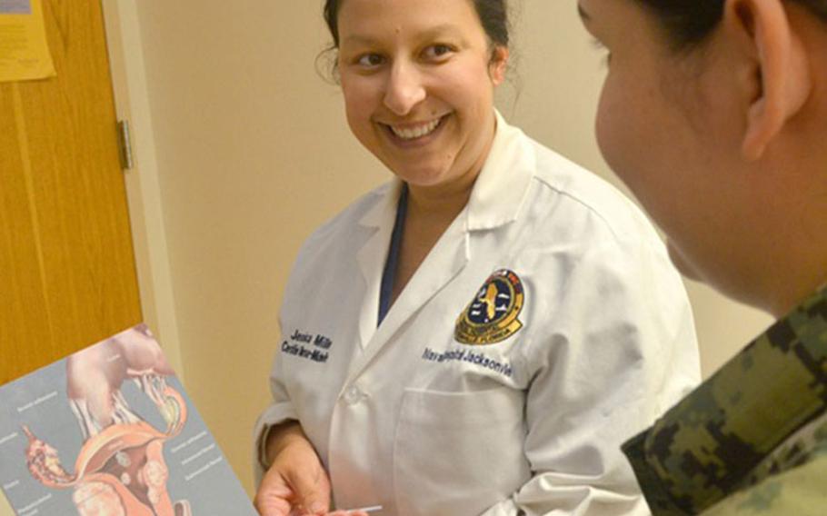 Navy Lt. Jessica Miller, a nurse at Naval Hospital Jacksonville’s Obstetrics/Gynecology Clinic, discusses cervical cancer screenings with a patient. Starting at age 21, women should get a Pap test every three years. After turning 30, women have a choice - get a Pap test every three years, or get a Pap and human papillomavirus (HPV) test every five years. (Photo by Jacob Sippel, Naval Hospital Jacksonville.)