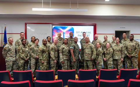 Photo Of U.S. Air Force Airmen and U.S. Marine Corps Sgt. Maj. Terrell Ford, Noncommissioned Officer Academy Okinawa director of staff, pose for a photo during the first annual Pacific Air Forces Strategic Development event at Kadena Air Base, Japan.