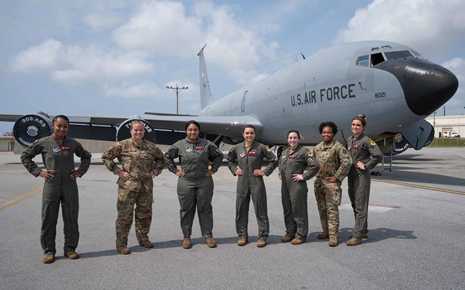 Airmen from the 909th Air Refueling Squadron and 718th Aircraft Maintenance Squadron pose for a photo at Kadena Air Base, Japan, March 21, 2022. The all-female crew flew to McConnell Air Force Base to conduct a tail-swap mission and participate in a community outreach event with Girl Scouts. (U.S. Air Force photo by Airman 1st Class Yosselin Perla)