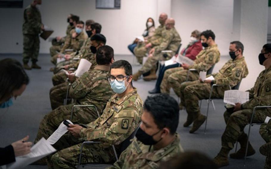 U.S. Army Soldiers from 1st Battalion, 214th Aviation Regiment, 12th Combat Aviation Brigade, go through questions and instructions prior to receiving their second COVID-19 vaccine on Feb. 24, in Wiesbaden, Germany (Photo by: Army Maj. Robert Fellingham, 12th Combat Aviation Brigade).