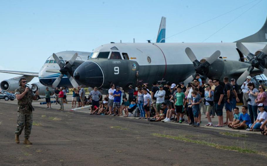 Capt. Jordan Vargas, a platoon commander for the 31st Marine Expeditionary Unit's Maritime Raid Force, speaks with a crowd before a tactical display of a vehicle interdiction during a community engagement event at Naval Air Museum Barbers Point, Kapolei, Hawaii, Jan. 19, 2019. (U.S. Marine Corps photo by Cpl. Isaac Cantrell/Released)