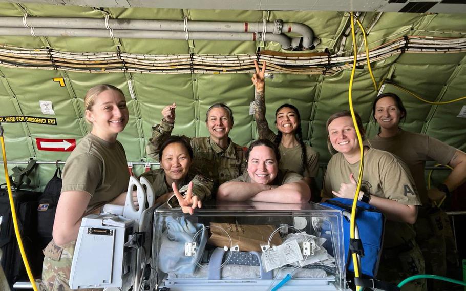 Airmen assigned to the 18th Medical Group neonatal intensive care unit, pose for a photo after the successful transport of two NICU infants, at Kadena Air Base, Japan, March 9, 2024. The all-female NICU and aeromedical evacuation Airmen worked tirelessly over the course of several days providing safe and efficient transport to NICU infants in need.