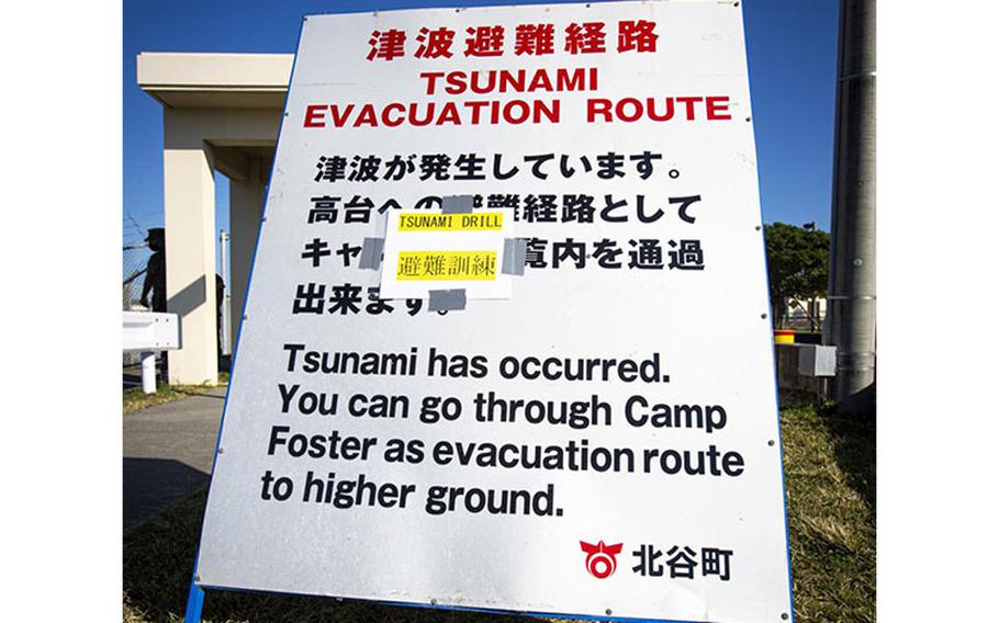 A sign is displayed to provide information to U.S. service members and local community residents as they participate in a tsunami evacuation drill on Camp Foster, Okinawa, Japan, Nov. 3, 2021. The drill was held to convey the readiness and capabilities of the camp to service members and local communities in the event of an emergency. (U.S. Marine Corps photo by Cpl. Karis Mattingly)