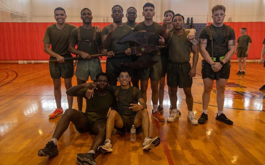 U.S. Marines with Regional Disbursing Office - Pacific, Combat Logistics Regiment 37, 3rd Marine Logistics Group, pose for a group photo after a dodgeball tournament during a regimental physical training event.