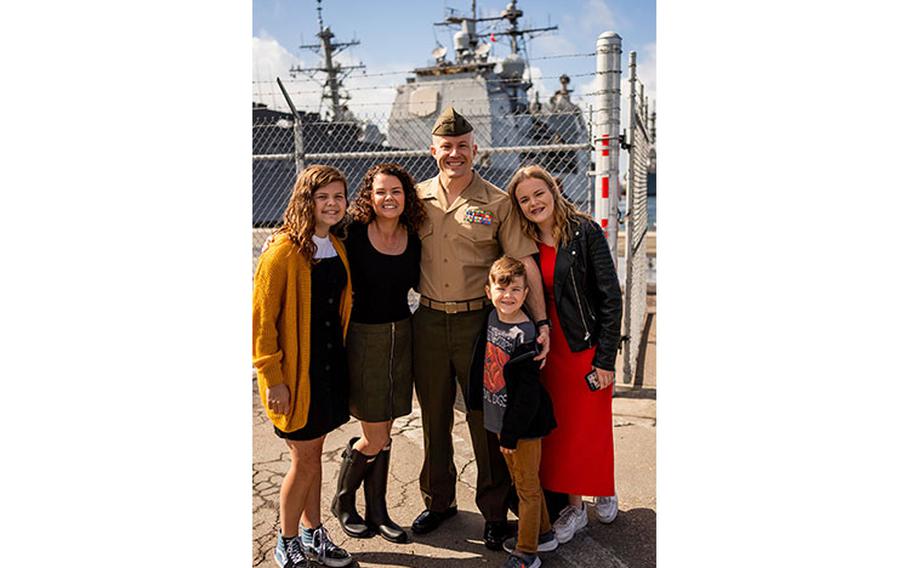 Brooke Mahaffey poses with her husband, Marine Corps CW03 Jacob Mahaffey, and her family. Photo by Tina Laser