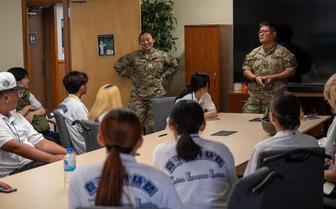 Photo Of U.S. Air Force Tech. Sgt. Soo Kim, right, 18th Wing Public Affairs community engagement non-commissioned officer in charge, and U.S. Air Force Airman 1st Class Amy Kelly, 18th Wing PA specialist, share their experiences as PA Airmen with Kadena Language Institute students during a tour at Kadena Air Base.
