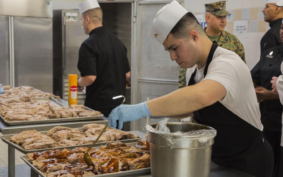 Marines prepare food for the Headquarters Marie Corps Inspection at Camp Foster, Okinawa, Japan, Feb. 25, 2020. The inspection was to insure Marines are being taken care of, and the best performing mess hall receives the title of USMC Chow Hall of the Year and receive the Major General W.P.T. Hill Award. (U.S. Marine Corps photo by Lance Cpl. Zachary Larsen)