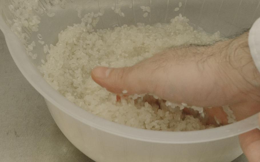 Rinse rice with water and put it in a bowl/basket.