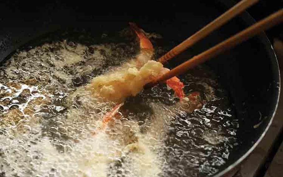 Sprinkle additional batter on top of the shrimp and fry for about 3 minutes. Take it out and drain excess oil.