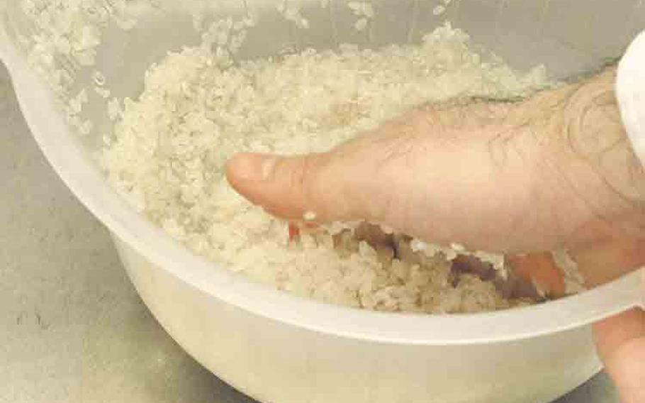 Rinse rice with water and put it in a bowl/basket.