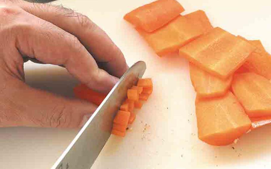 Likewise, slice a carrot into cubes with 5 mm sides.