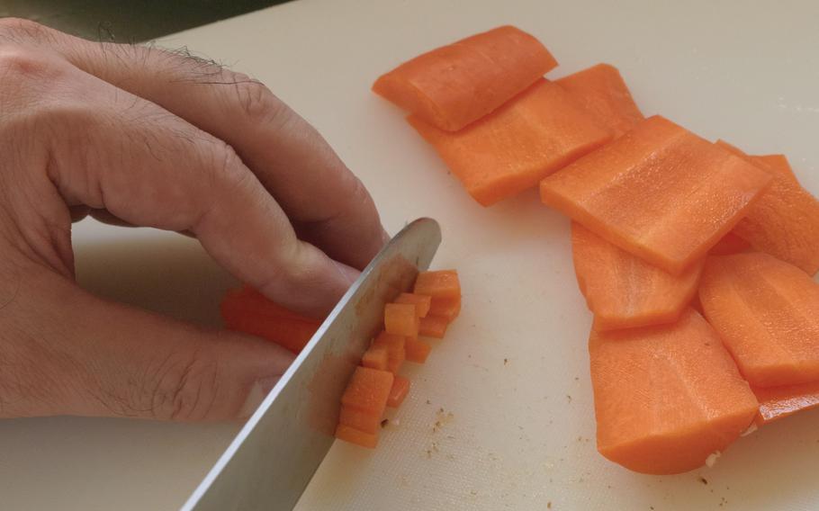 Likewise, slice a carrot into cubes with 5 mm sides.