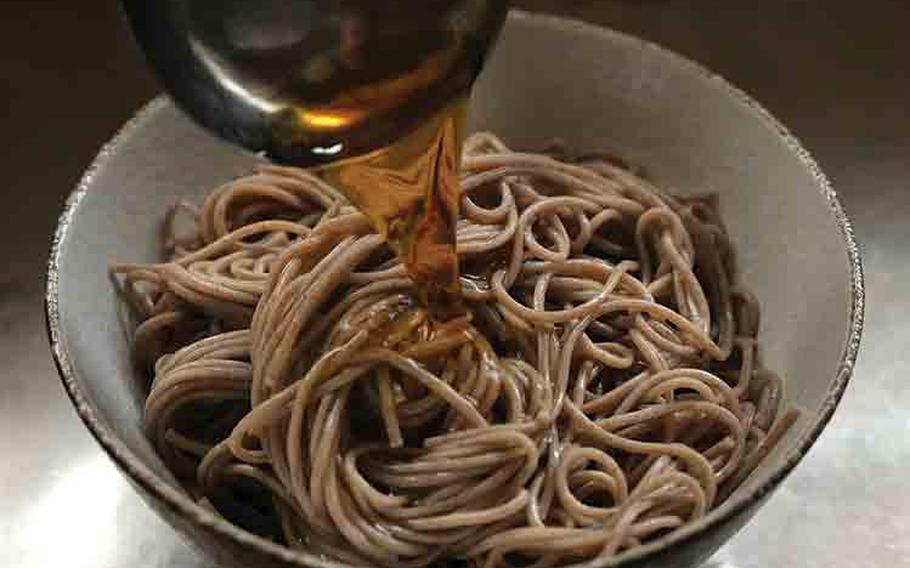 Portion out your noodles into a bowl and pour the broth over. 