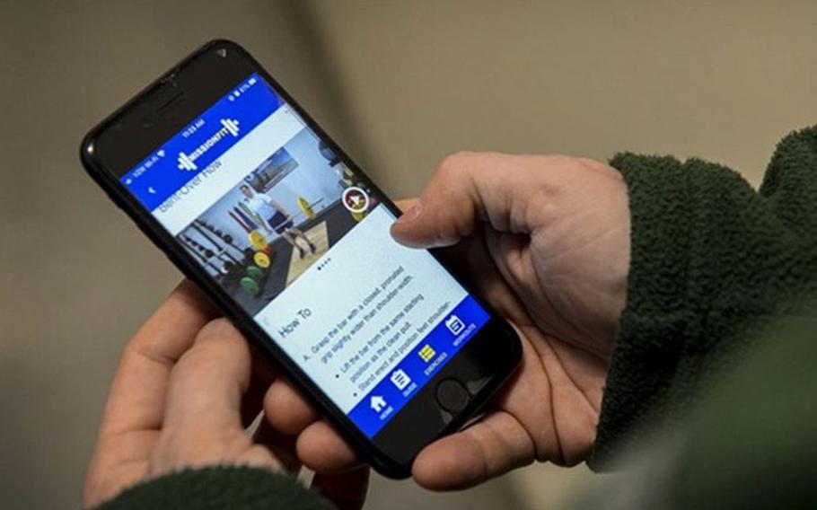 A smartphone user navigates the DHA’s Air Force MissionFit app, at Hanscom Air Force Base in Massachusetts in February 2020. The app offers a 12-week program of exercise routines along with a library of more than 90 exercises and detailed instructions with video, images and text (Photo by: Lauren Russell, 66th Air Base Group Public Affairs).
