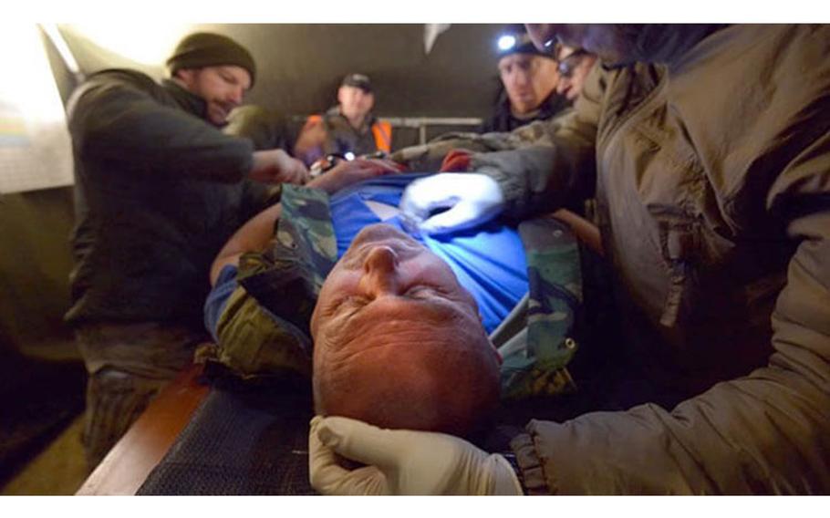 Multinational soldiers treat a simulated casualty during the final field training exercise of a six-month medical training course hosted by the International Special Training Centre in which twenty-four Special Operations Forces Soldiers from 10 different nations participated, March 1, 2017. (Photo: Air Force Reserve Tech. Sgt. Chris Hibben, 4th Combat Camera Squadron)