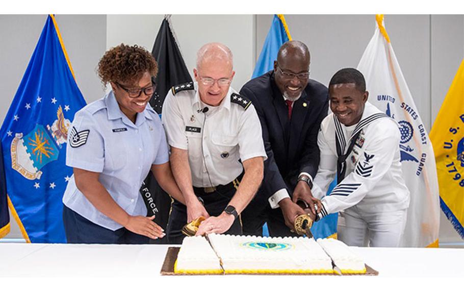 The Defense Health Agency celebrated its ninth year as a combat support agency, one of eight combat support agencies in the Department of Defense. Cutting the ceremonial birthday cake are: (From left to right) U.S. Air Force Tech. Sgt. Candace Stanfield, DHA health informatics division; U.S. Army Lt. Gen. (Dr.) Ronald Place, DHA director; Ronald Hamilton, DHA Deputy Assistant Director for Administration and Management; and U.S. Navy Petty Officer 1st Class Kossi Nyatso, DHA military personnel support.