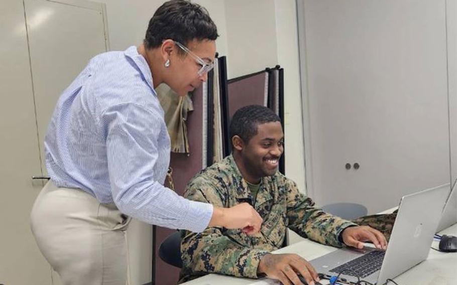 A GENESIS onsite instructor helps a student. Photo by Isaac Savitz