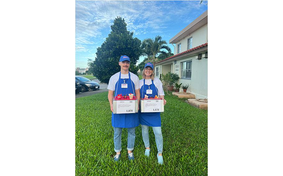 two people wears costumes in the garden.