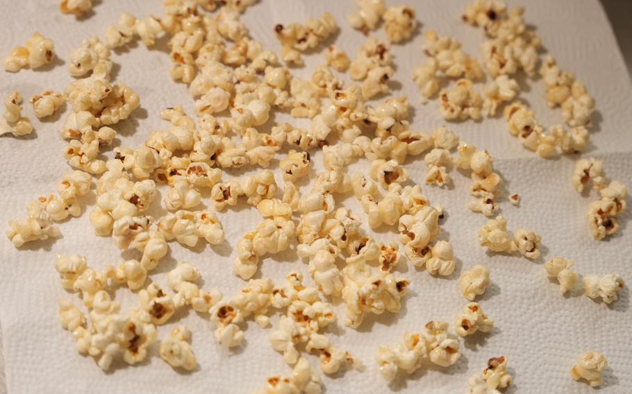 10 Spread the popcorn out on a cookie sheet lined with parchment paper and let it cool. (Make sure to spread the popcorn as the sauce is sticky and this will ensure the popcorn is coated separately.)