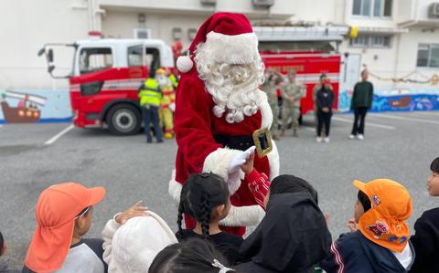 Photo Of U.S. Army Garrison Okinawa’s Santa Claus greets local children from Takenoko and Pono-Pono daycare centers during a Holiday celebration in Yomitan Village, Okinawa, Japan, on Dec. 19, 2024.