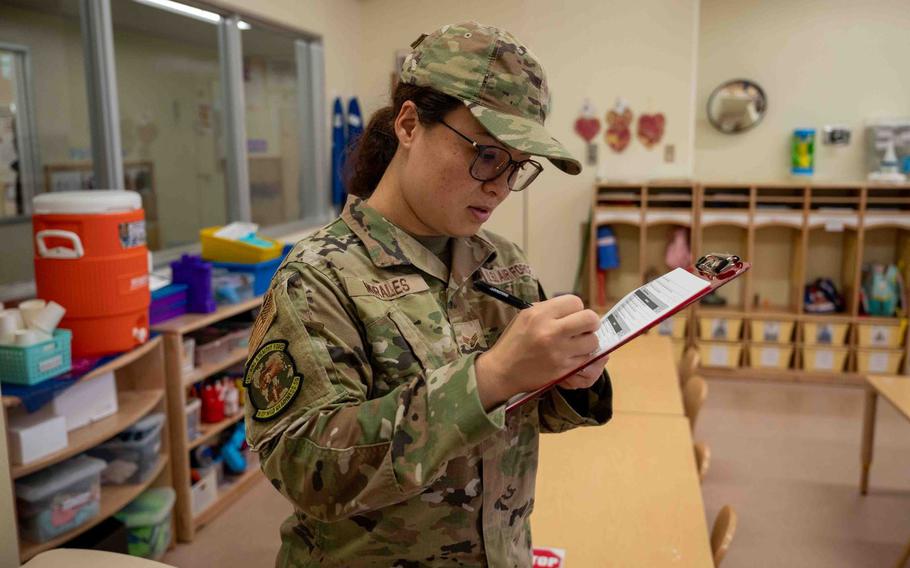 Senior Airman Reina Morales fills out the quality control sheet.