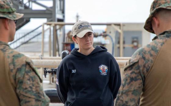 Chief Warrant Officer 2 Amanda F. Hurley, the vessel master of the U.S. Army boat LCU 2032 Palo Alto meets with her Marine counterparts before a joint training exercise between the U.S. Army’s 5th Transportation Company, part of the 765th Transportation (Terminal) Battalion and the U.S. Marines’ Battalion Landing Team 2/4, 31st Marine Expeditionary Unit.