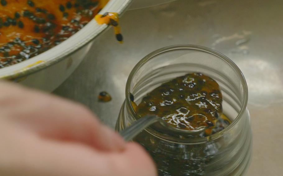 Put the jam in a jar.