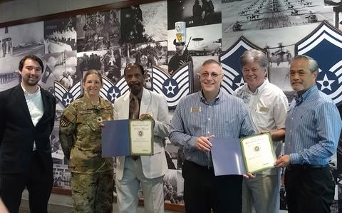 Photo Of Kadena Rocker Enlisted Club and Banyan Tree Pizza & Grill staff group photo as Stars and Stripes Pacific Commander Lt. Col. Marci Hoffman presents award.