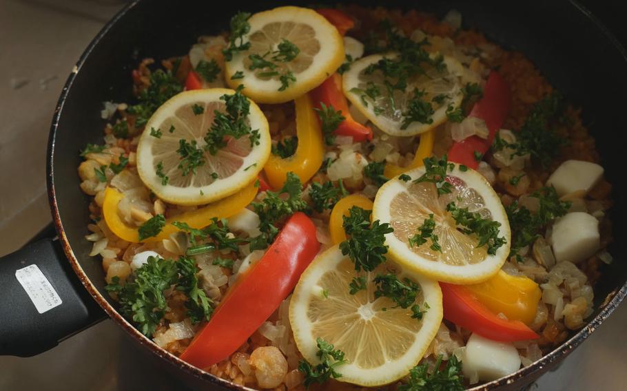 Top with sliced lemon and parsley.