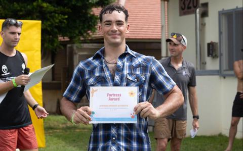 Photo Of U.S. Marine Corps Cpl. Connor J. Giardina poses for a photo with a certificate.