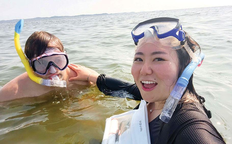 two people enjoying snorkeling.