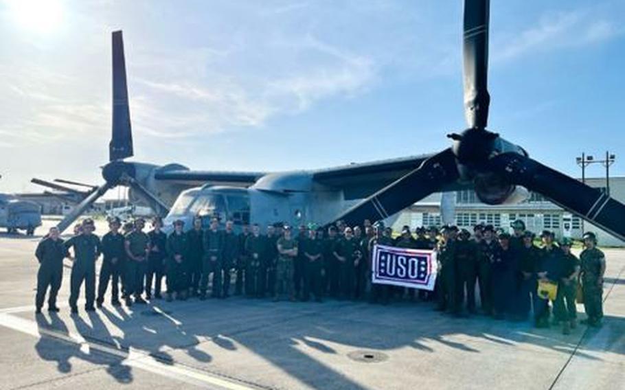 Marines of VMM-265 getting ready to deploy, posing in front of their Squadron’s Aircraft.