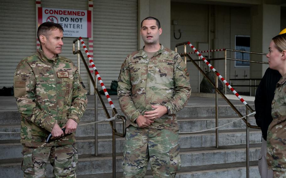 Staff Sgt. Brandon Faulk shows Brig. Gen. Stephen Snelson and Chief Master Sgt. Dennis Fuselier infrastructure concerns.