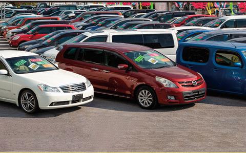 Photo Of A lot of used cars are parked for selling at Johnny’s Used Cars.