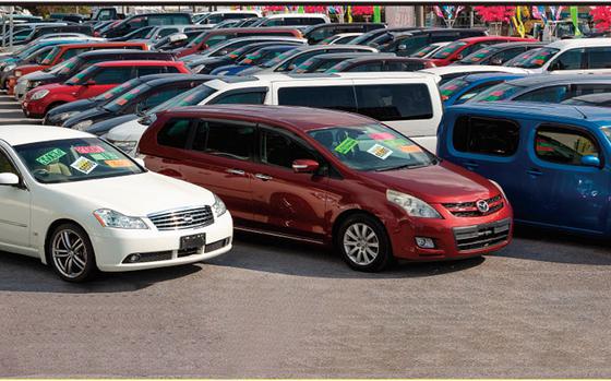 Photo Of A lot of used cars are parked for selling at Johnny’s Used Cars.