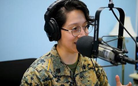 Photo Of One of the AFN staff members speaks on the radio.