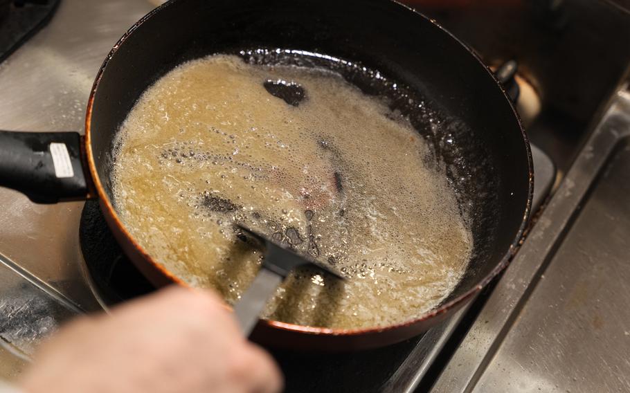 6 Place the pan over medium heat and keep stirring the ingredients to avoid burning the sauce.