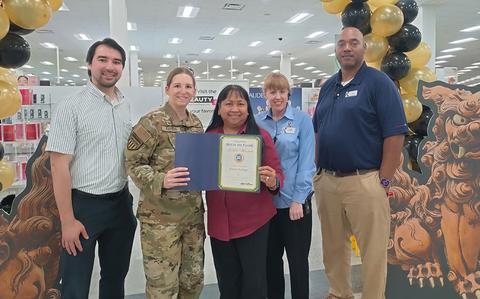 Photo Of Lt Col Hoffman and Mr. Tanaka pose with Kadena Main Exchange staff members