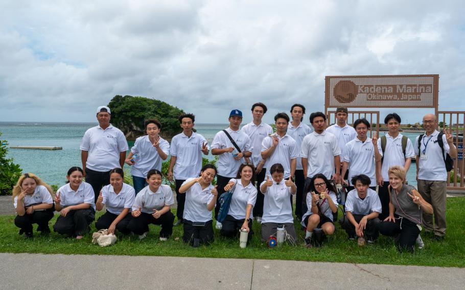 Kadena Language Institute students and teachers pose for a photo outside the Kadena Marina before a tour at Kadena Air Base, Japan, July 18, 2025.