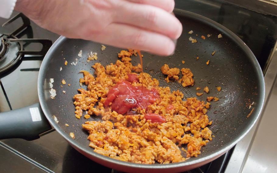 Add ketchup, medium thick sauce (tonkatsu sauce), and salt before frying the mixture until it becomes dry. Finish it up by adding black pepper.