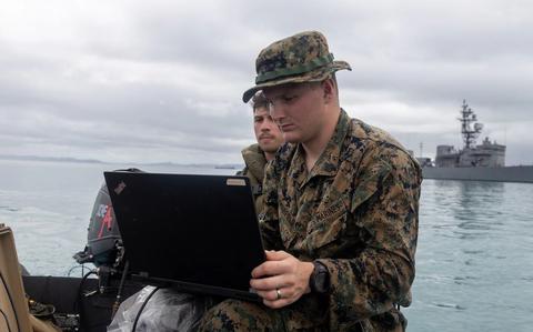 Photo Of U.S. Marine Corps Sgt. Dylan Hairfield uses a CEESCOPE during a small boat sustainment training event.