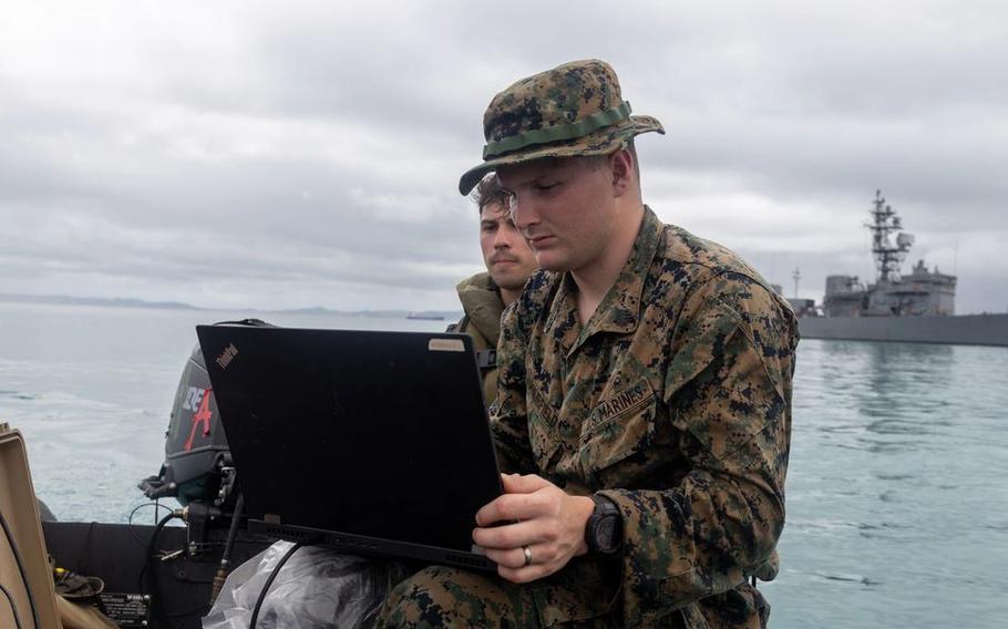 U.S. Marine Corps Sgt. Dylan Hairfield uses a CEESCOPE during a small boat sustainment training event.